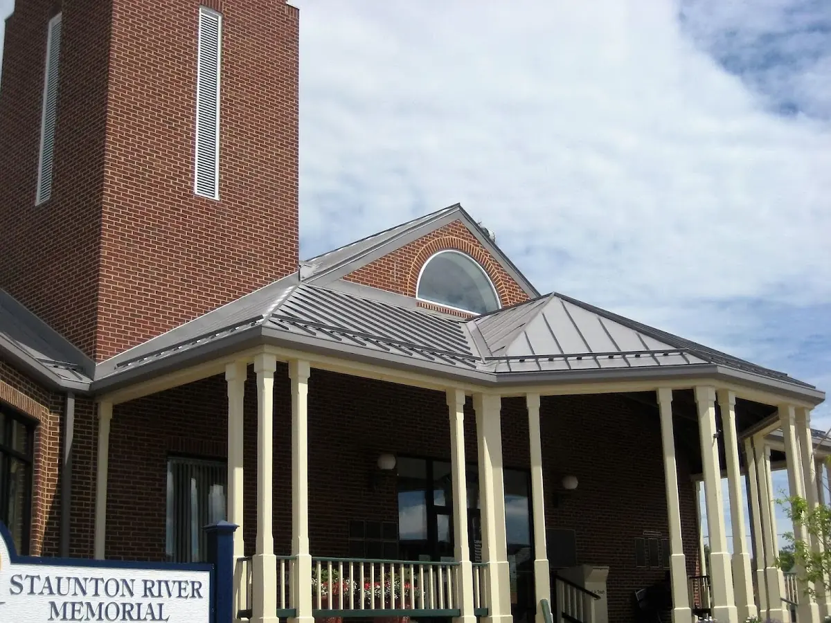 Skilled roofing craftsmen working on a residential roof in Enterprise